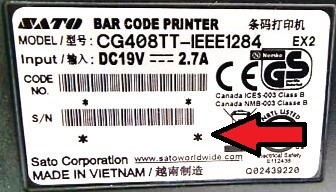 A bar code label with red arrow pointing to it

Description automatically generated